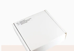 A white corrugated mailer box from the LA Custom Packaging homepage.